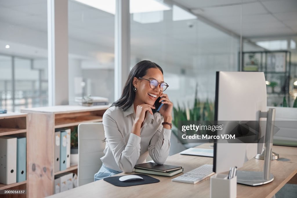 Phone call, business and woman with a computer, conversation and smile with project and talking. Person, office and employee with pc and worker with joy and laughing with communication and discussion