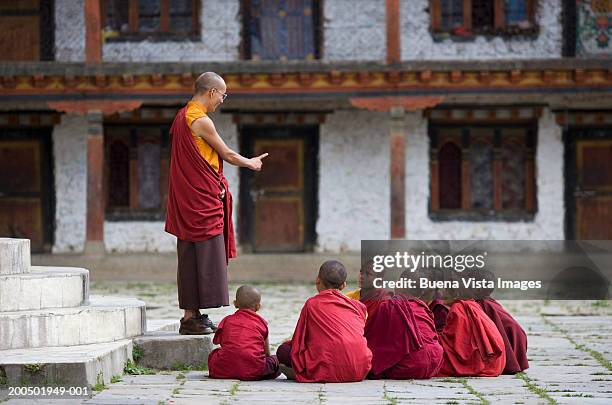 bhutan, bumthang, karchu dratsang monastery, buddhist lama teaching - buddhism stock pictures, royalty-free photos & images