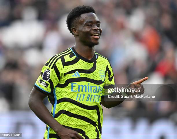 Bukayo Saka celebrates scoring the 5th Arsenal goal during the Premier League match between West Ham United and Arsenal FC at London Stadium on...