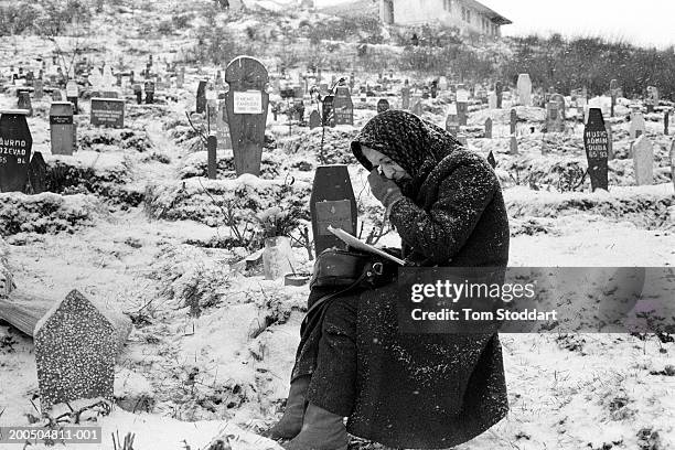 Bosnia, Sarajevo A woman grieves at the grave of her son in a snow covered Sarajevo cemetery. During the 47 months between the spring of 1992 and...