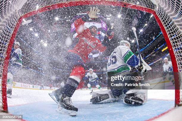 Tom Wilson of the Washington Capitals collides into the goal in front of goalie Thatcher Demko of the Vancouver Canucks during the seco period at...