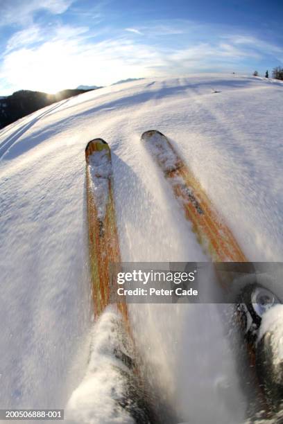 mature man skiing, low section, (wide angle, blurred motion) - la plagne stock pictures, royalty-free photos & images