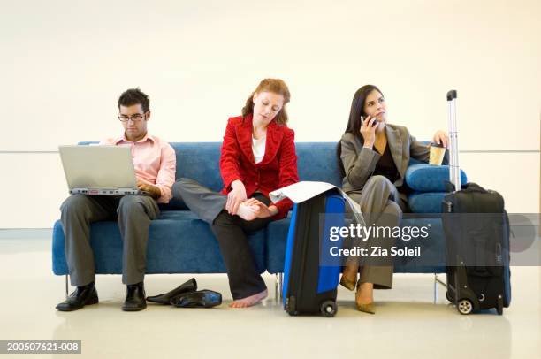 three business people on sofa - valise soleil stock pictures, royalty-free photos & images