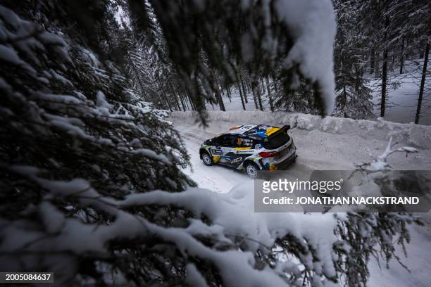 William Creighton of Ireland and his co-driver Liam Regan of Ireland steer their Ford Fiesta Mk II during the shakedown of the Rally Sweden, second...