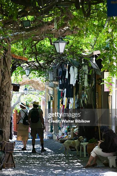 greece, lesvos, mytilini town, avenue of souvenir shops - lesbos stockfoto's en -beelden