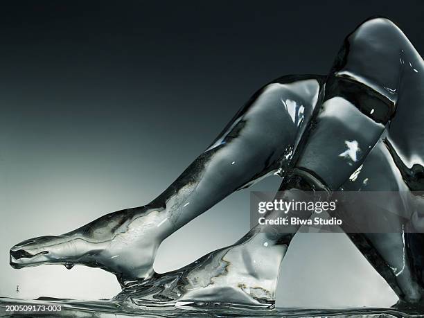 ice sculpture of human legs - ice sculpture stock pictures, royalty-free photos & images