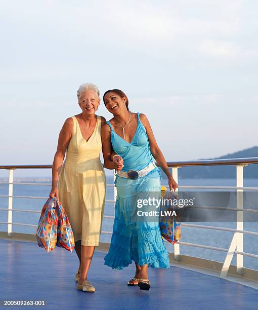 two mature women on cruise ship, laughing - river cruise stock-fotos und bilder