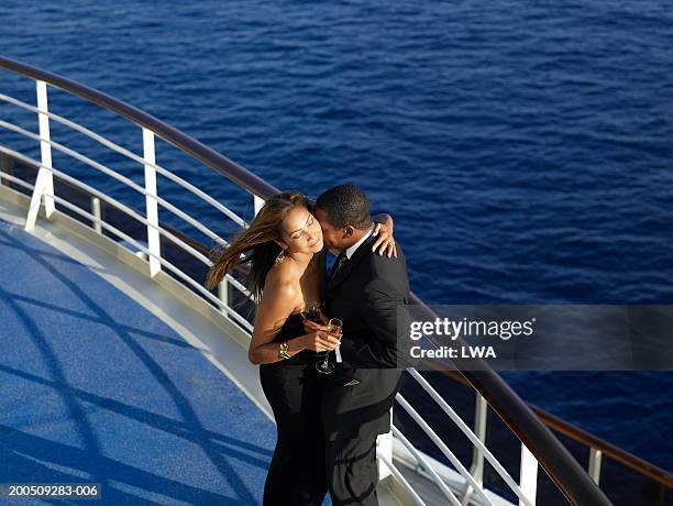 mature couple embracing on deck of ship, elevated view - cruise deck stock pictures, royalty-free photos & images