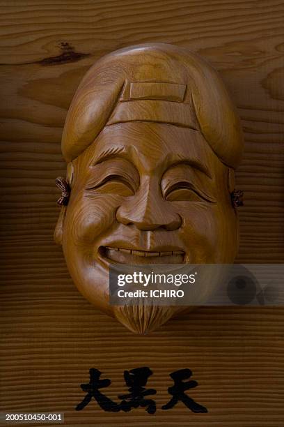 wooden carving of daikokuten, god of wealth - daikoku ストックフォトと画像