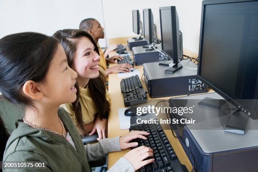 Random Students Using Computers Group Of Students Using Computers In Classroom Side View High-Res Stock ...