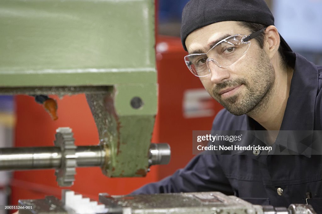 Man working in machine shop, portrait
