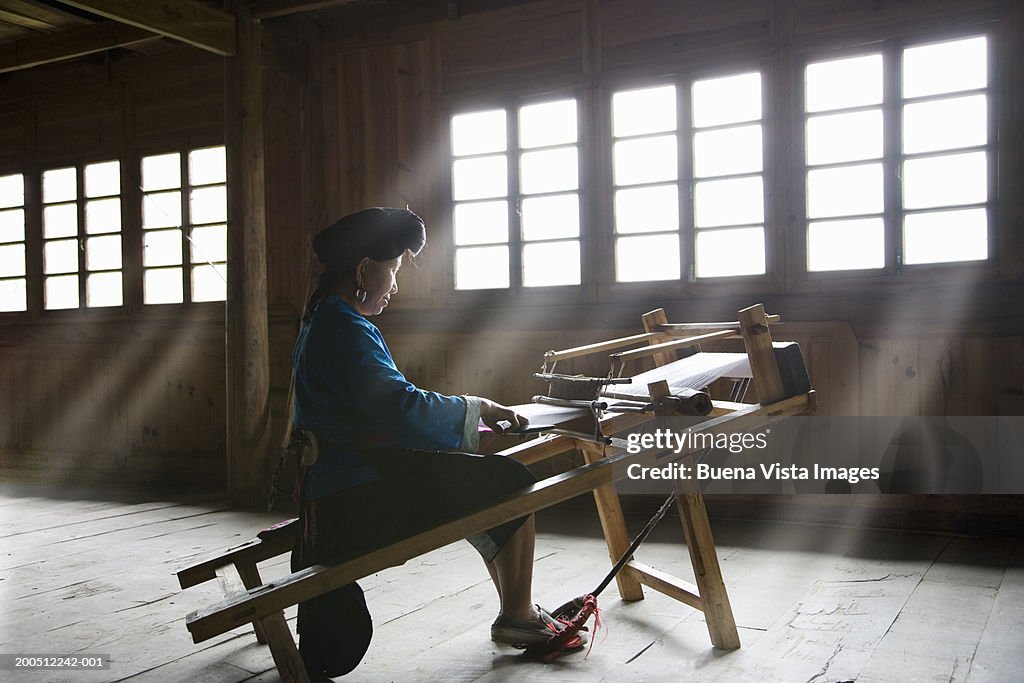 China, Guangxi Province, Jinkeng, woman weaving