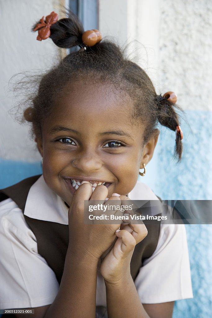 Schoolgirl (5-7) smiling, portrait