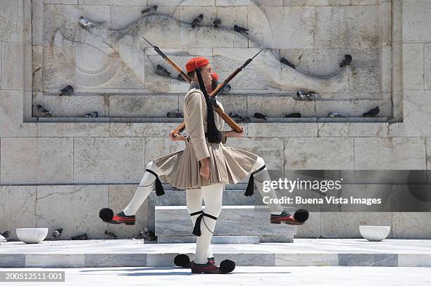 greece, athens, honor guard at tomb of unknown soldier - changing of the guard stock pictures, royalty-free photos & images