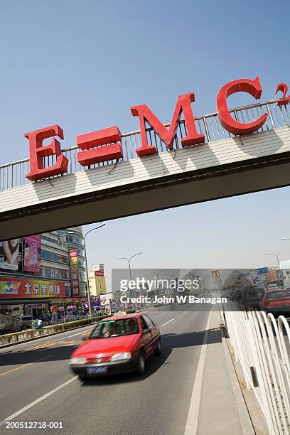 pedestrian flyover with e=mc2 decoration - einstein stock pictures, royalty-free photos & images