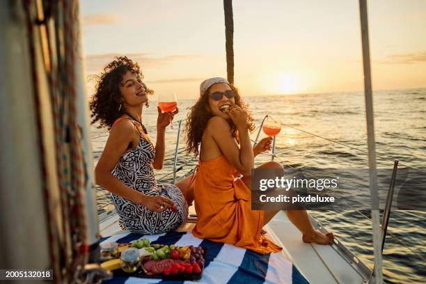 golden hour glow on the ocean - luxury fashion industry stock pictures, royalty-free photos & images