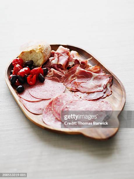 prosciutto, salami, capicola, kalamata olives, peppers and bread - salami stock pictures, royalty-free photos & images