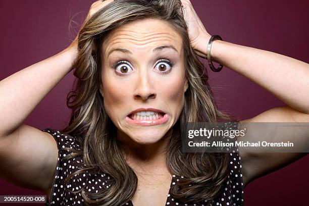 woman with hands in hair, portrait - pulling hair stock pictures, royalty-free photos & images