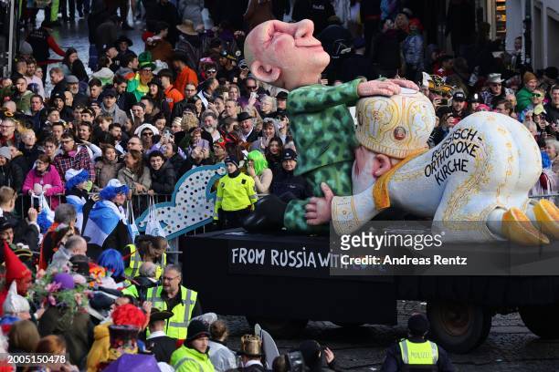 Parade float shows an effigy of the Russian President Vladimir Putin and a member of the Orthodox Church at the annual Rose Monday Carnival parade on...