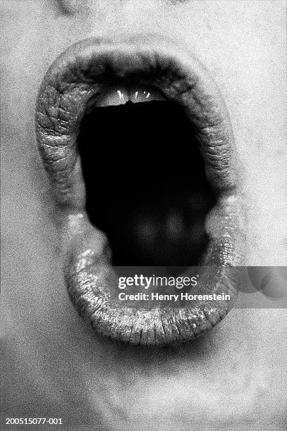 woman shouting, close-up of mouth - boca fotografías e imágenes de stock