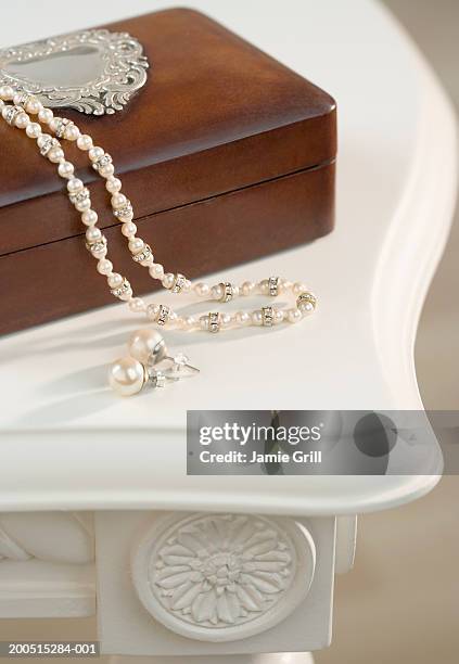 pearl necklace and earrings on wooden jewellery box, close-up, cropped - earring box stock pictures, royalty-free photos & images