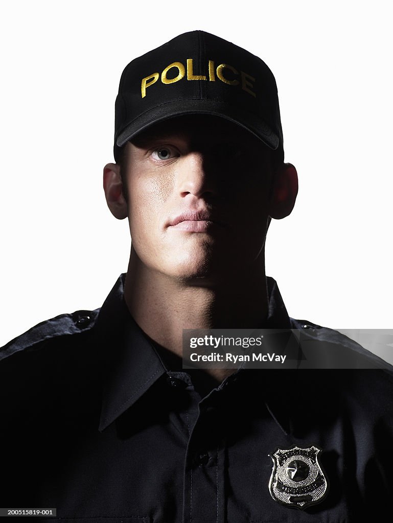 Young male police officer, portrait