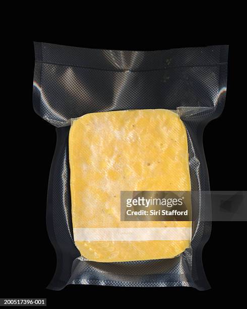frozen vacuum sealed block of macaroni and cheese - vacuum packed fotografías e imágenes de stock
