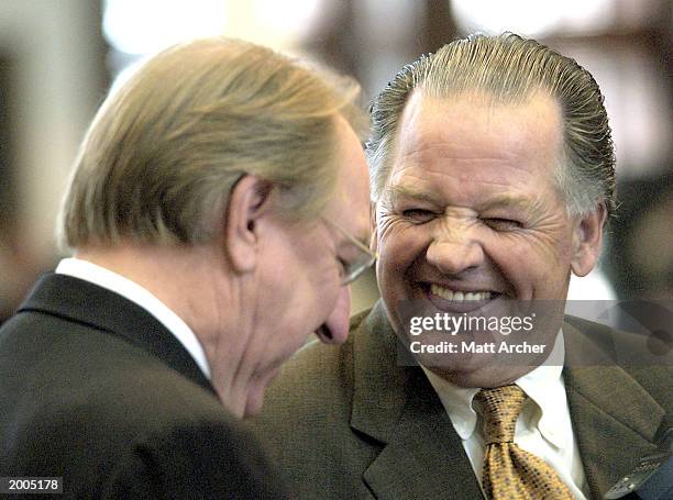 Texas State Representitive Pete Laney jokes with Representitive Tommy Merritt on the floor of the Texas House Chamber May 16, 2003 in Austin, Texas....