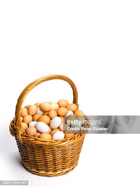 basket of white and brown eggs, white background - eggs in basket stock pictures, royalty-free photos & images