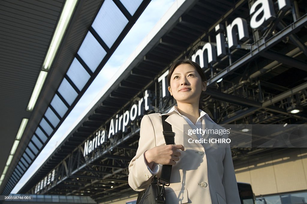 Japan, Chiba Prefecture, young businesswoman at Narita Airport