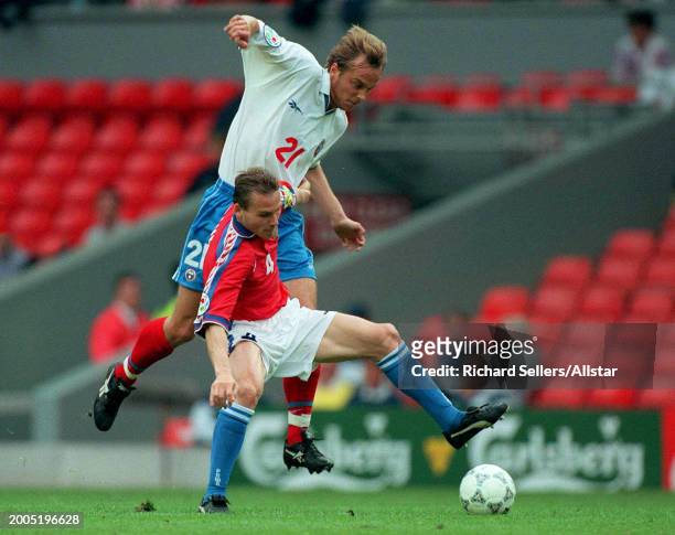June 19: Dmitri Khokhlov of Russia and Pavel Nedved of Czech Republic challenge during the UEFA Euro 1996 Group C match between Russia and Czech...