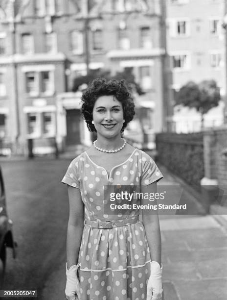 British actress Joan Gardner wearing a polka dot dress, October 22nd 1956.