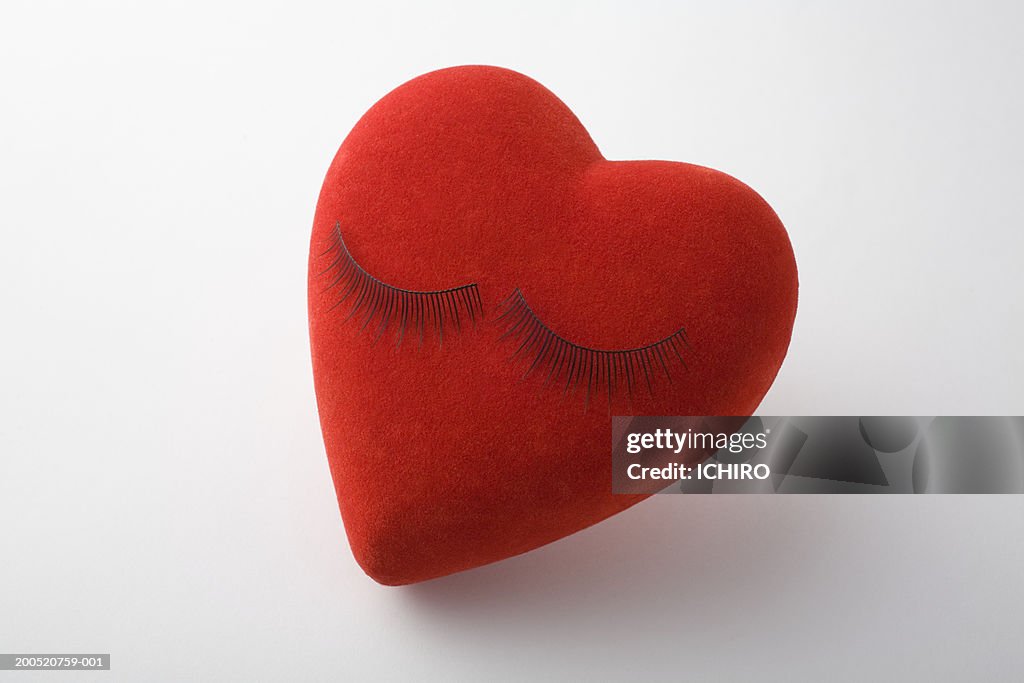 False eyelashes on heart-shaped pillow