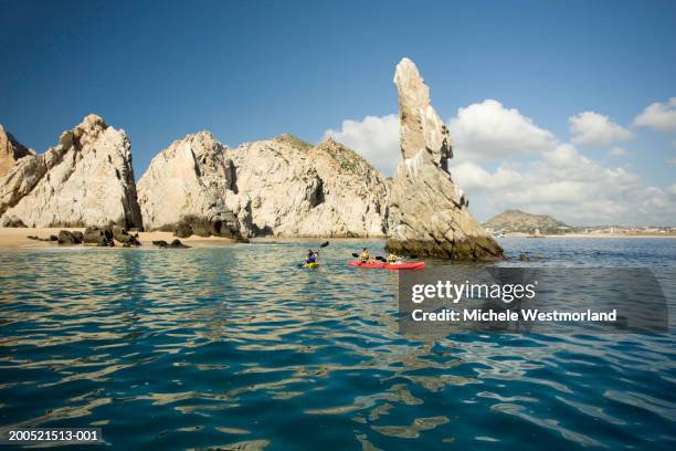 "mexico, baja, cabo san lucas, land's end, four adults kayaking" - cabo san lucas fotografías e imágenes de stock