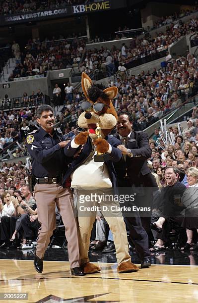 Coyote, the Spurs mascot does his best interpretation of actor Jack Nicholson as he gets tossed out of the game by SBC Center arena security during a...