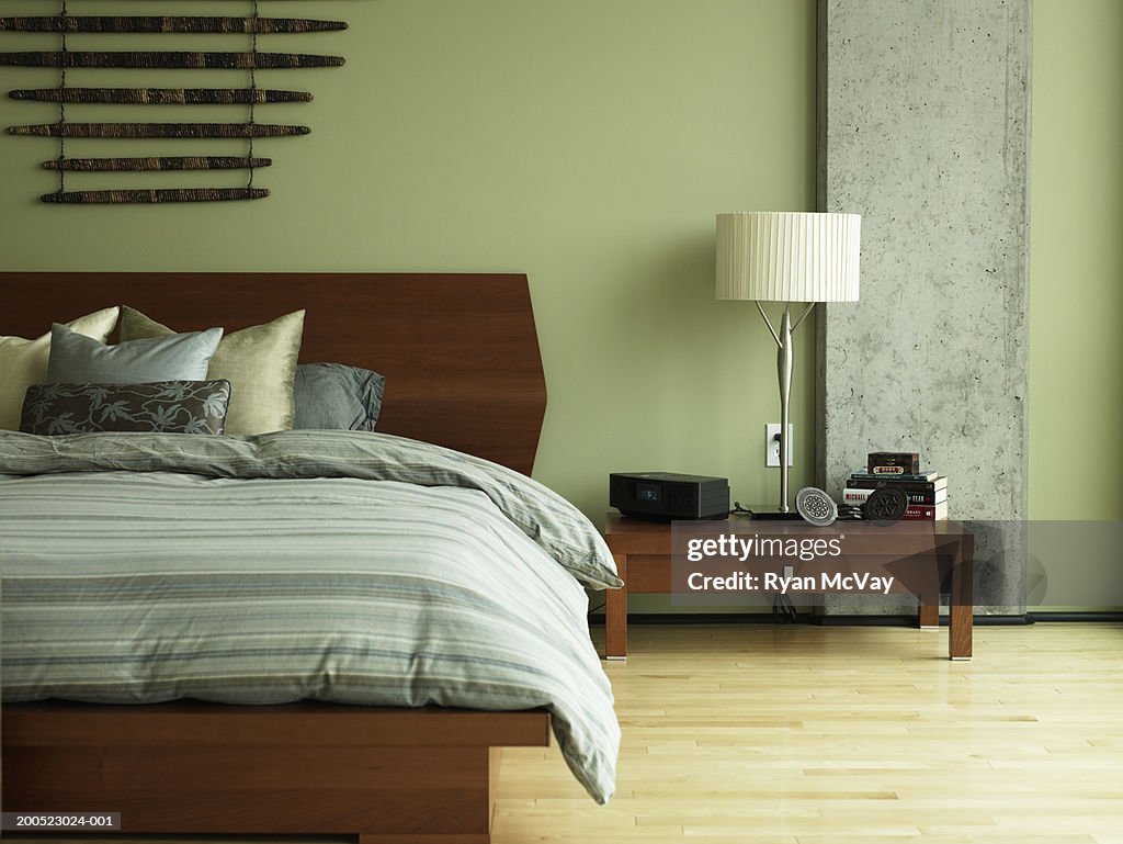 Bed and night table in bedroom