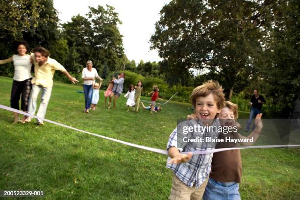 Three Kids Racing Three Legged Race Kids Photos and Premium High Res Pictures - Getty Images
