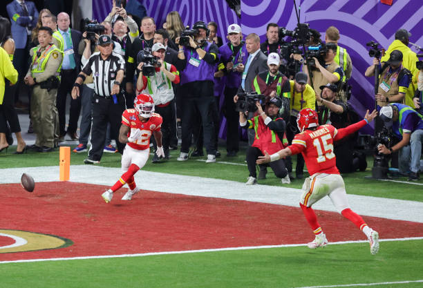 Wide receiver Mecole Hardman Jr. #12 and quarterback Patrick Mahomes of the Kansas City Chiefs celebrate after they connected on a game-winning...