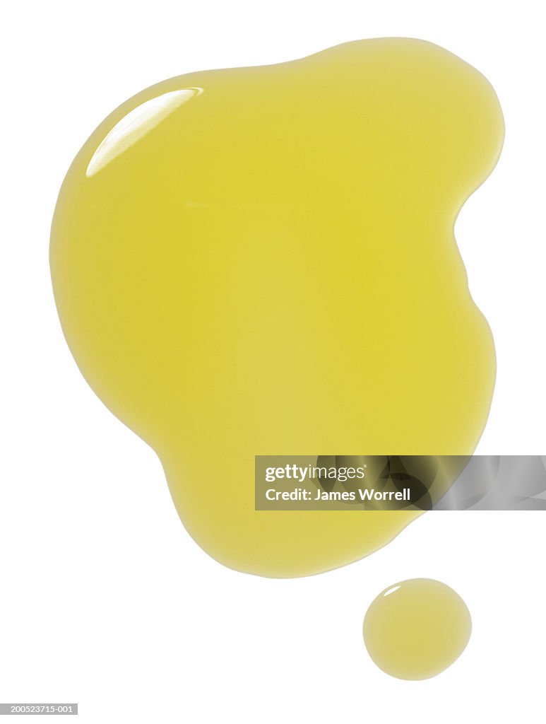 Puddle of olive oil on white background