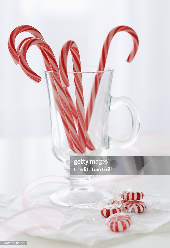 Candy canes in glass mug