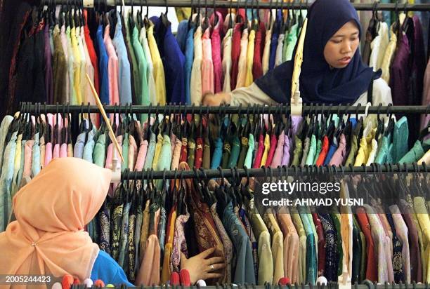 Women choose their dress at Jalan Tunku Abdul Rahman, the most busiest street during Ramadan in Kuala Lumpur, 10 November 2002. Although the month of...