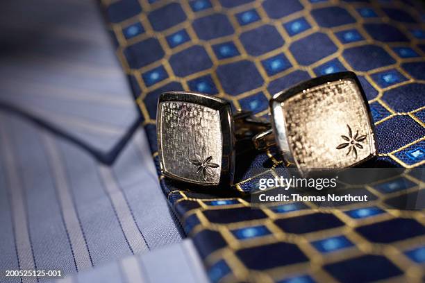 cuff links, tie and button down shirt, close-up - manschettenknöpfe stock-fotos und bilder