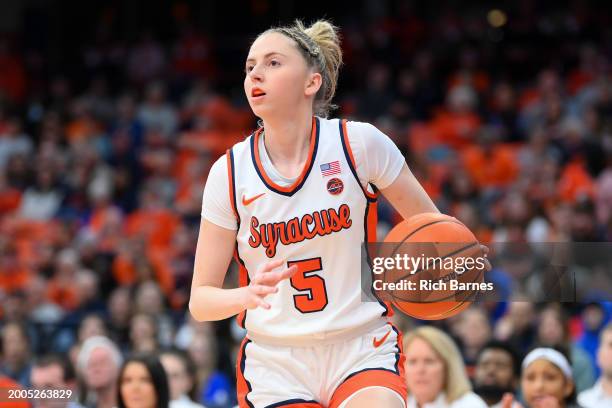 Georgia Woolley of the Syracuse Orange drives against the Louisville Cardinals during the first half at JMA Wireless Dome on February 11, 2024 in...