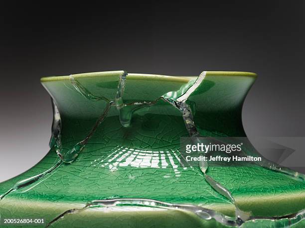 broken green vase glued together, close-up (still life) - broken vase stock pictures, royalty-free photos & images