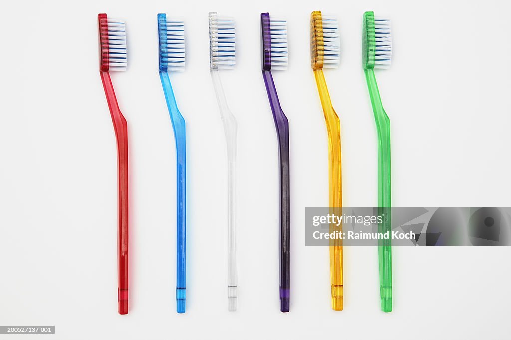 Row of multi-coloured toothbrushes