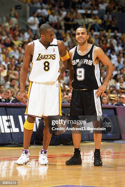 Kobe Bryant of the Los Angeles Lakers shares a light moment with Tony Parker of the San Antonio Spurs in Game two of the Western Conference...