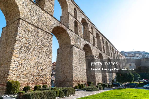 low angle vie of the aqueduct in kavala, greece - aqueduct stock pictures, royalty-free photos & images
