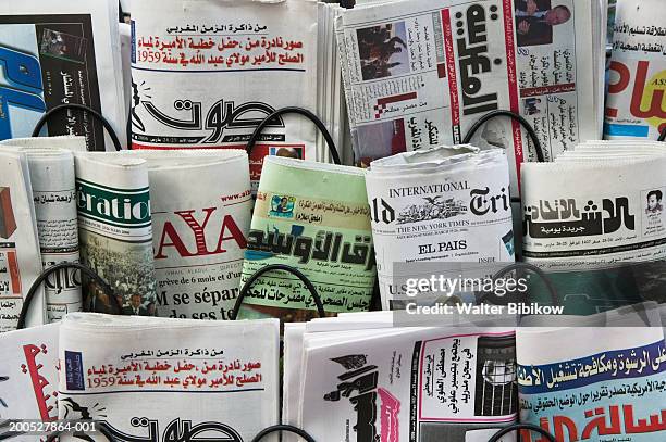 newspapers for sale in rack, close up - arabic literature stock pictures, royalty-free photos & images