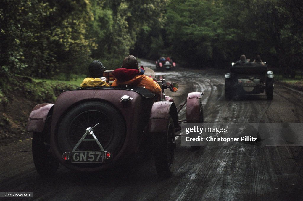 Argentina, Mille Miglia Classic Car Race, race cars on road, rear view