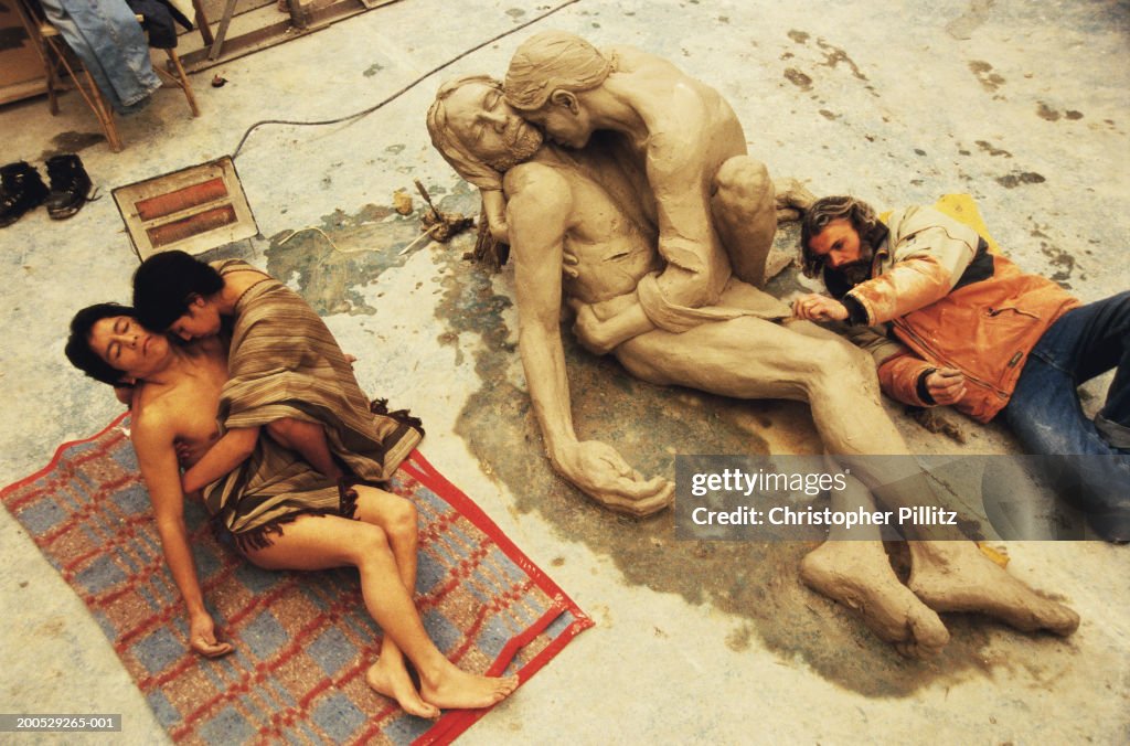 Argentina, artist sculpting couple as Jesus and Mary Magdelene